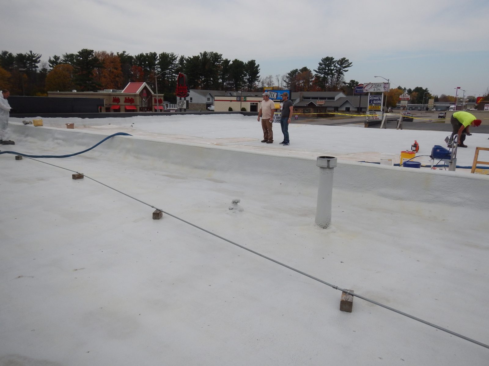 Low-slope roof restoration in progress
