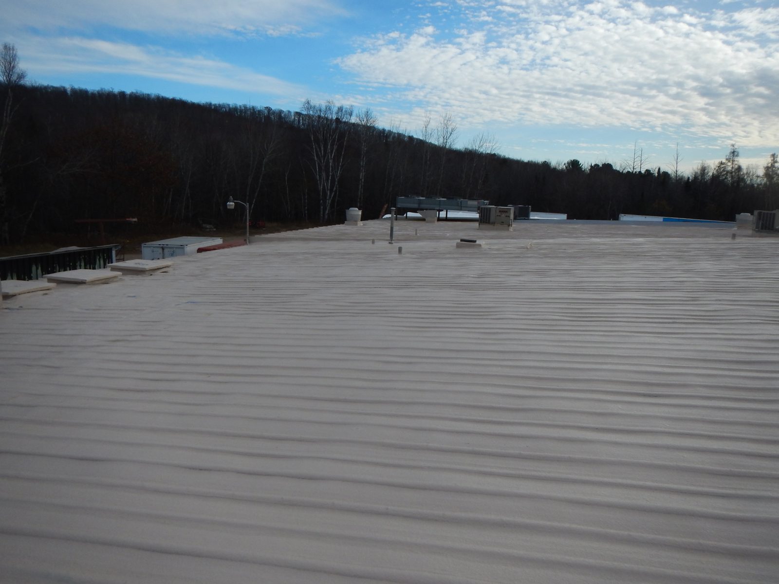 Reflective roof topcoat